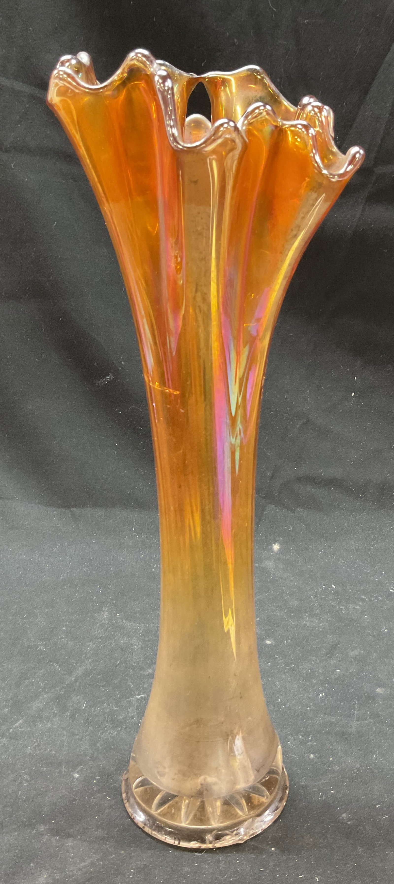 Vtg Marigold Ribbed Opalescent Carnival Glass Vase: Vintage marigold ribbed opalescent carnival glass vase. Carnival effect iridescent rainbow like sheen. Thin ribbed design with marigold color. 11.5 x 4 inches. Some surface wear consistent with exposu