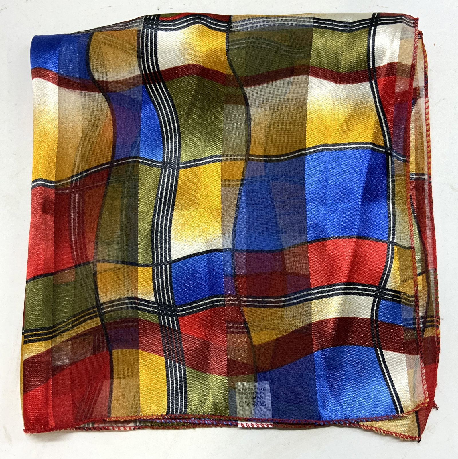 Multicolor Retro Square Print Scarf KOREA: Scarf features a vibrant, multicolored fabric featuring a retro square look. Tags read MADE IN KOREA. Surface wear consistent to age, use & exposure. Measurements: length 20in x width 20in. Scarf, pol