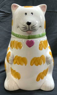 Vntg Hand Painted Tabby Cat Cookie Jar W Lid: Cookie jar is vintage. Piece is hand painted. Cookie jar is porcelain. Cookie jar has cat form. Cookie jar includes lid. Piece measures approximately 10 inches tall 6.75 inches wide 6.5 inches deep. C