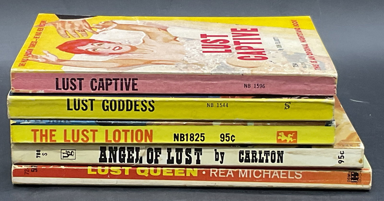 5 Pulp Fiction Erotica Books, 1962 LUST CAPTIVE+: Five Paperback Pulp Fiction Erotica Books. Includes 1962 Nightstand Book LUST CAPTIVE by DON ELLIOT, LUST GODDESS by DON ELLIOT, THE LUST LOTION by CURT ALDRICH, ANGEL OF LUST by BLAIR CARLTON, and LU