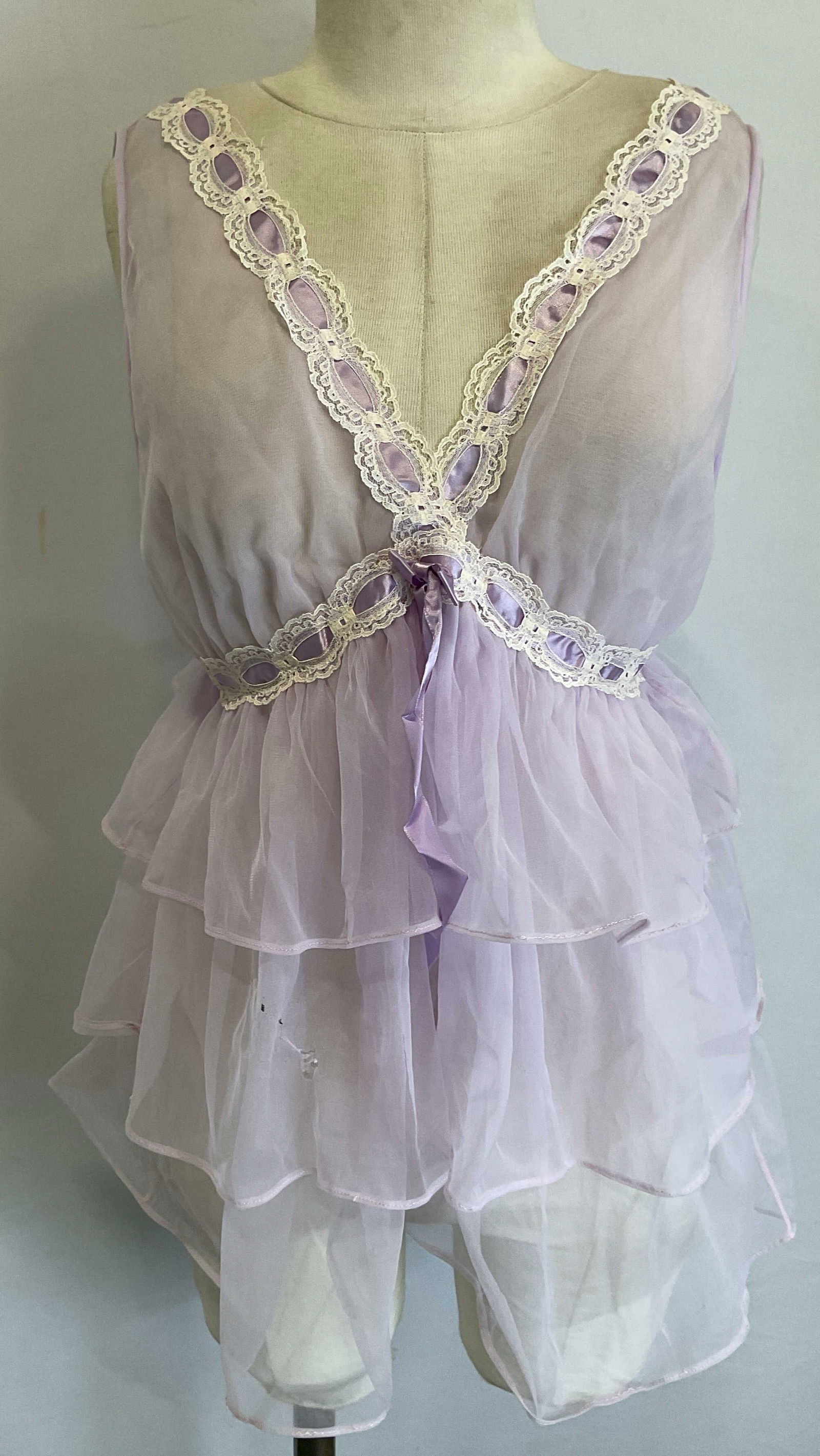 Vtg Nan Flower Purple Tiered Lace Intimate Top: Vintage Nan Flower womens intimate sleepwear garment. Sheer purple tiered top with lace trim. Nylon. Measures approx 13 inches across chest. Some blemishes and small holes. Ladies top, ladies intimate