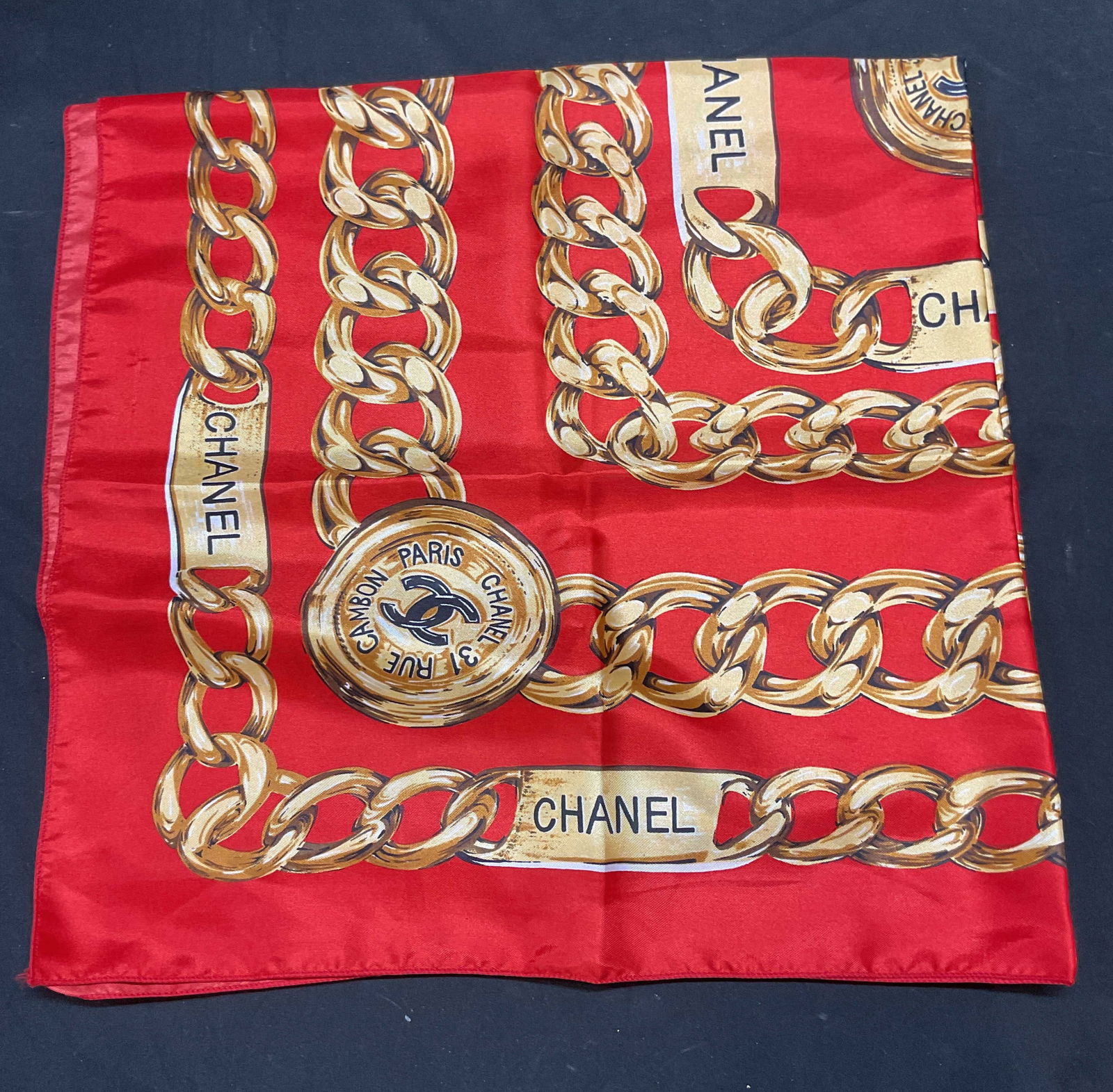 Red & Gold Chain Pattern Scarf: Red and gold chain pattern scarf. Feels like silk, possibly synthetic. Measures approx 32 x 32 inches. Some blemishes. Red scarf, gold scarf, chain pattern scarf, accessories, fashion accessories, wea