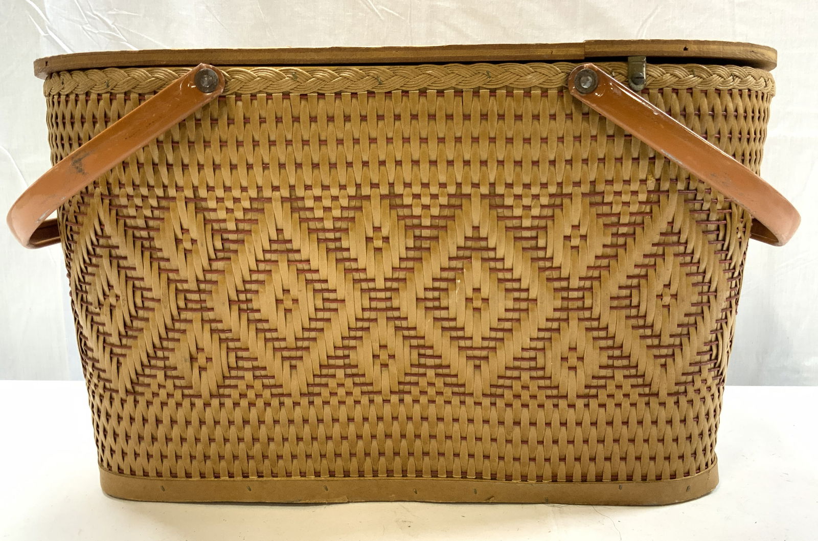 REDMON PERU Wicker Wooden Picnic Basket: REDMON PERU Wicker Wooden Picnic Basket Picnic basket feature a hinged wood lid & metal handles. Signed & marked on interior of basket. Reads REMON PERU. Surface wear consistent to age, use & exposure