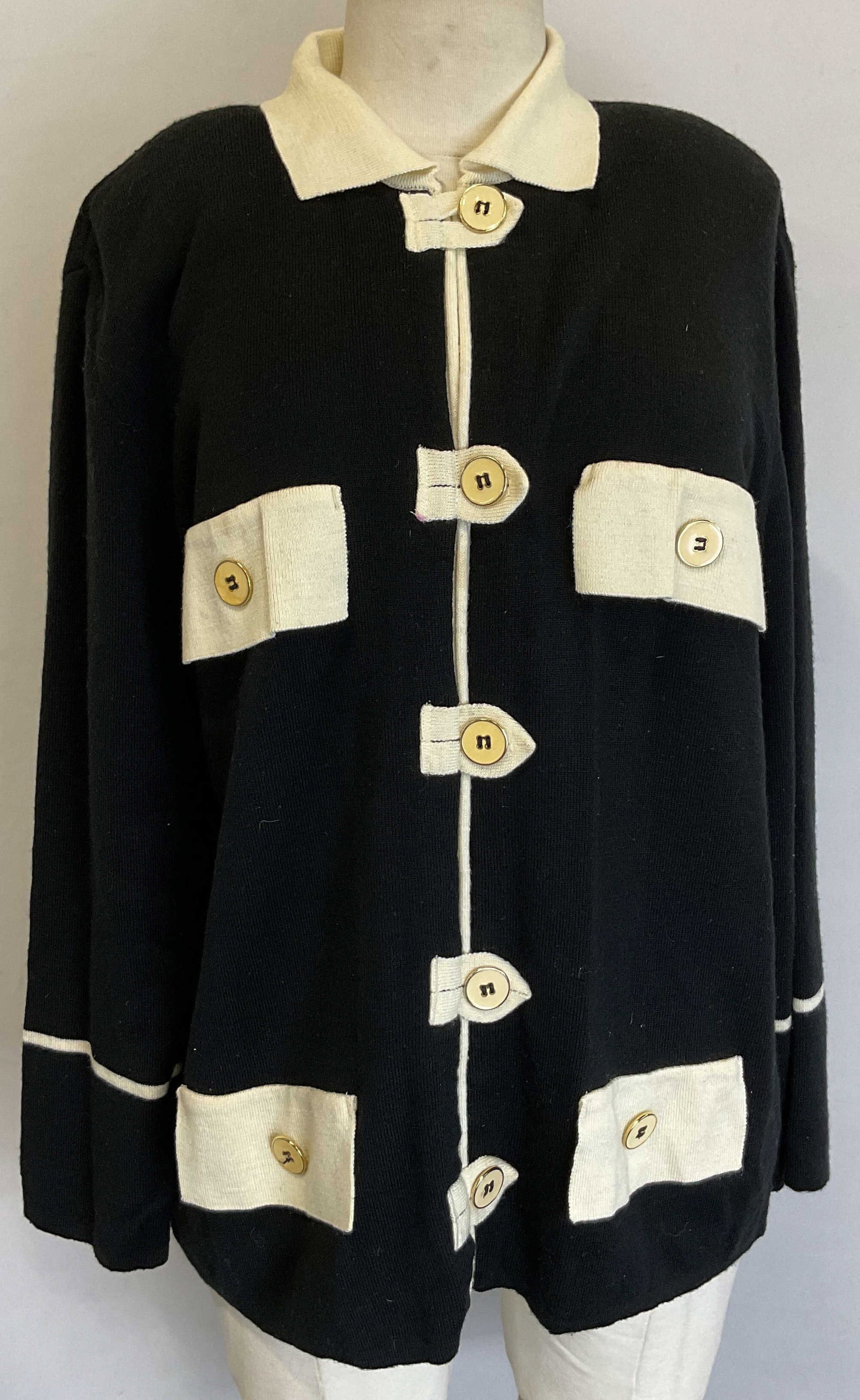 Vtg Marnel Black White Cotton Acrylic Top Portugal: Vintage Marnel black and white cotton acrylic top. Black sweater with white collar, white accent designs. 4 faux pockets. Shoulder pads present. Button down front. Made in Portugal. 50% cotton, 50% ac