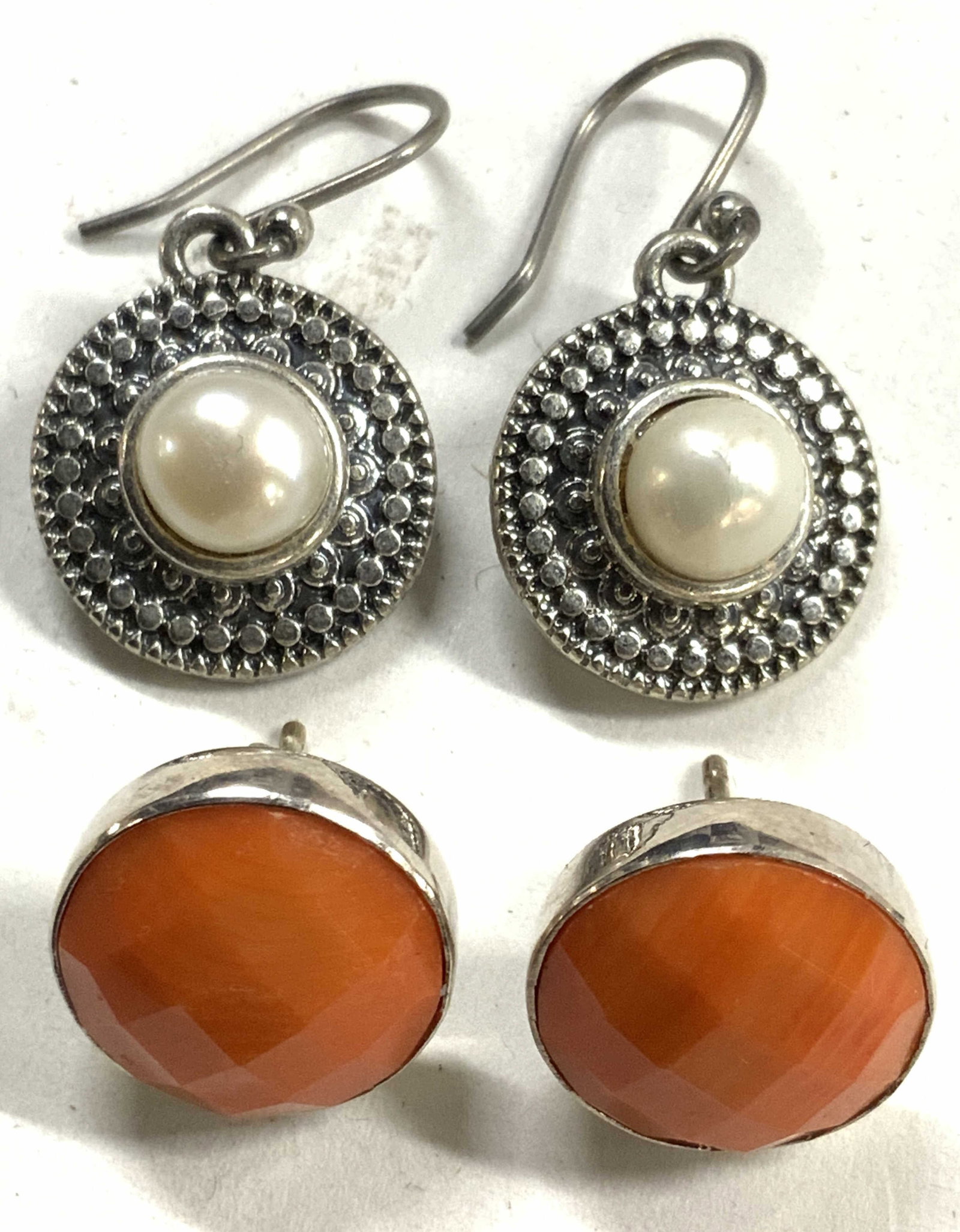 2 pairs Womens Earrings: Lot includes 2 faux pearl and metal dangling earrings & 2 earrings with orange toned enameled circular studs. Dangling earrings measure approximately 1 inch tall .5 inches wide . Earrings, womens earr