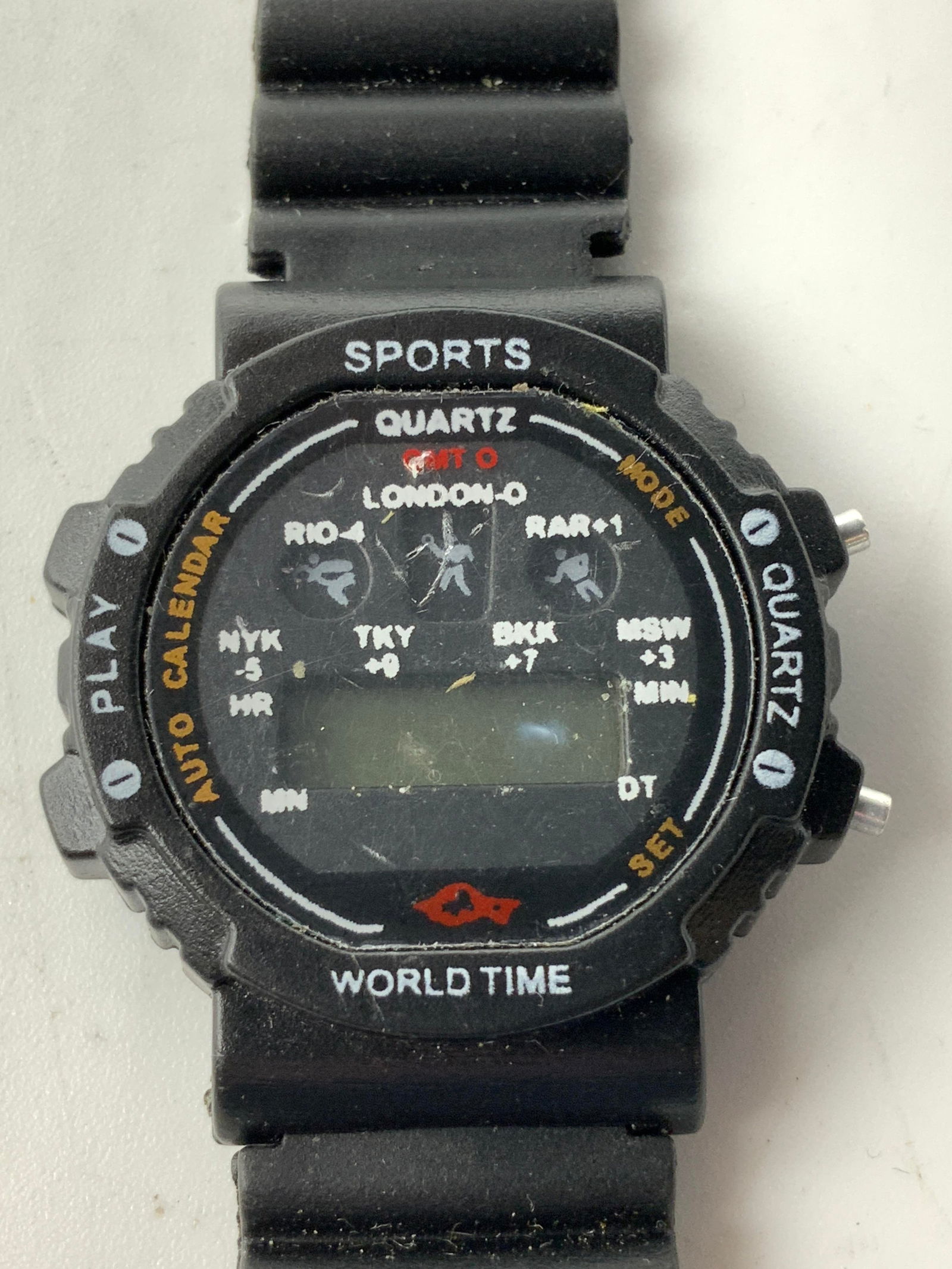 Vntg World Time Sports Digital Black Watch: Vntg World Time Sports Digital Black Watch Digital quartz watch with a world time function & featuring an American flag on the band. Signed & marked. Surface wear consistent to age, use & exposure. Me