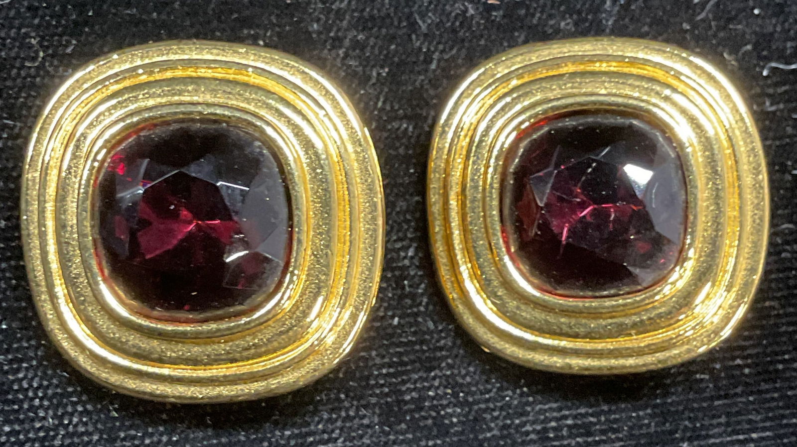 GIVENCHY Paris Gold Tn Purple Crystal Earrings: GIVENCHY gold tone and purple Crystal square stud earrings. Signed. Measure approx 1 x 1 inches. Some wear including scratching observed. Jewelry, estate jewelry, costume jewelry, cocktail jewelry, fa