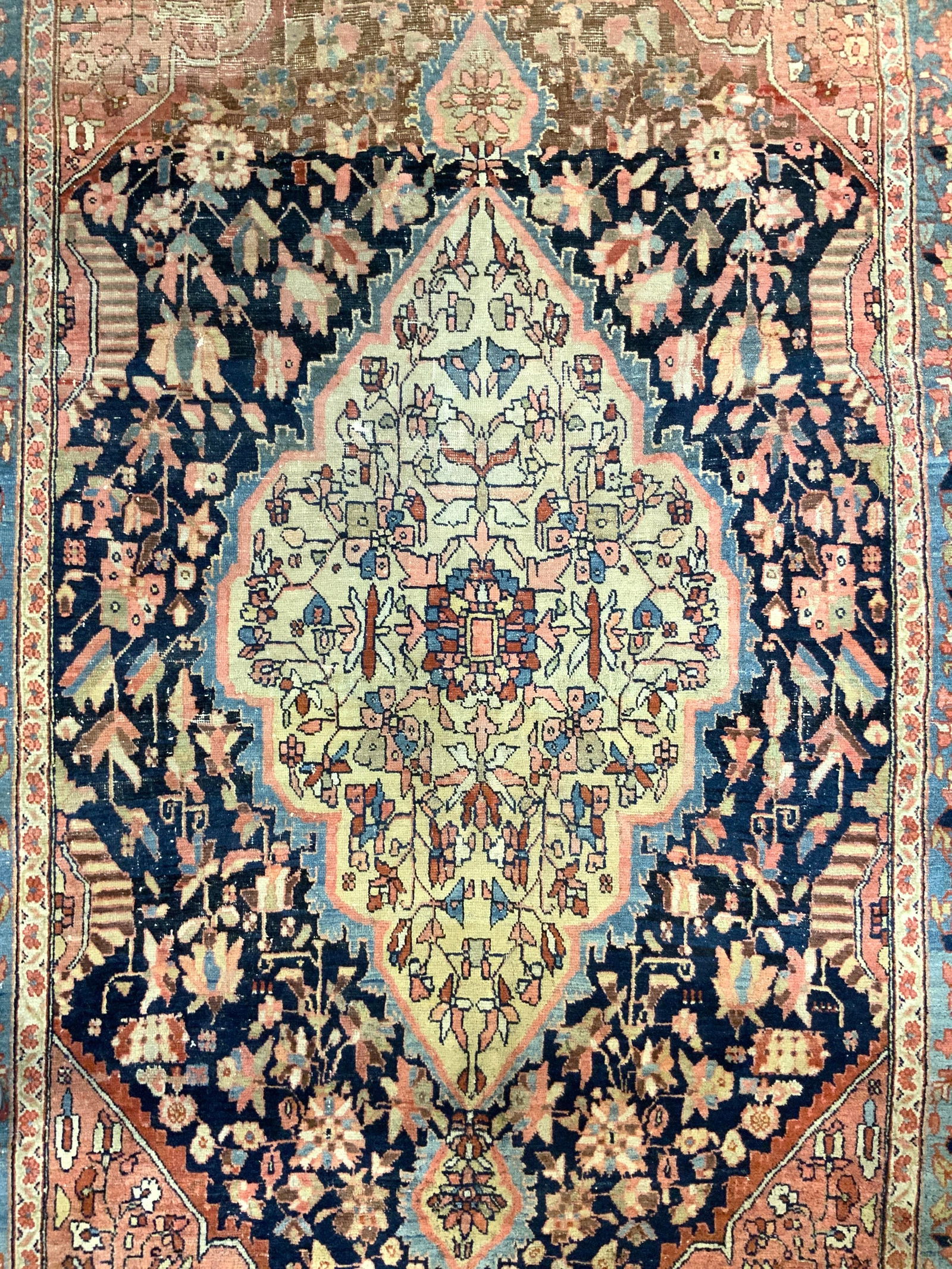 Vintage Handmade Persian Wool Area Rug: Rug is handmade and wool. Piece is Vintage appears to be Persian. Rug has intricate multi toned floral motif detail. Measures approximately 85 inches long 56 inches wide. Rug, carpet, area rug, wool r