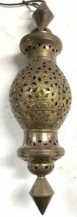 Moroccan Brass Hanging lamp W Pierced Detail 20in: Lamp is vintage. Piece appears to brass possibly gilt metal. Moroccan pendant lamp with intricate etched and pierced detail. Top of lamp has gilt metal hook to hang. Piece measures approximately 20 in