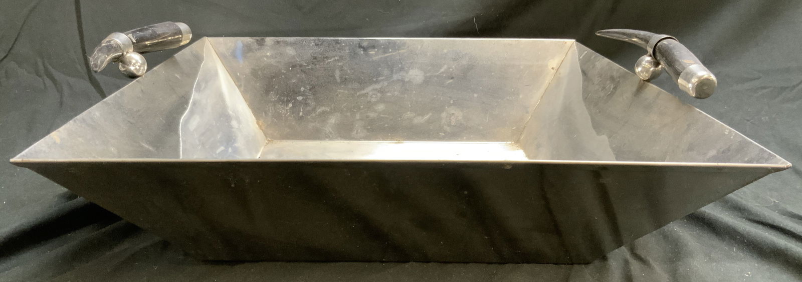 Deep Metal Tray W Black Toned Bone Handles 21in: Tray is silver toned and metal. Tray has depth. Piece has black toned bone handles. Tray has square form. Piece measures approximately 21 inches wide 19 inches deep 6 inches tall. Tray, metal tray, tr
