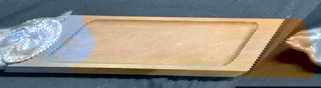 Rams Head Pewter & Wood Charcuterie Board: Charcuterie board has pewter silver toned rams head. Remainder of piece is light brown toned and wooden. Charcuterie board has shallow basin. Rams head has relief to show facial features. Board measur
