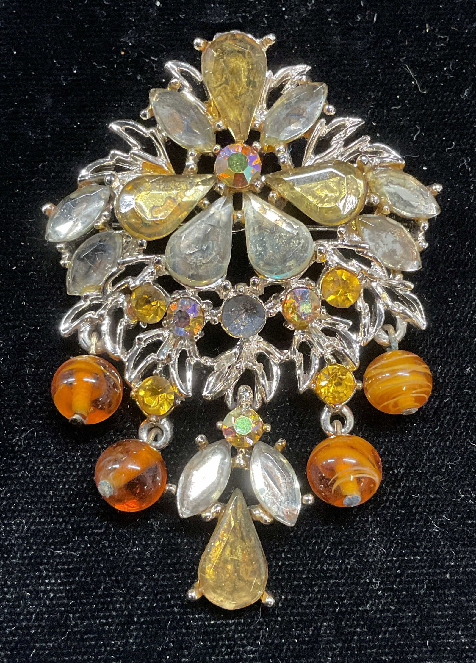 Vtg ART Arthur Pepper Gold Tn Crystal Brooch.: Vintage Arthur Pepper gold tone flower motif chandelier brooch with crystal decoration. Signed ART. Measures approx 2.5 x 2 inches. One crystal needs replacement. Some wear including scratching observ