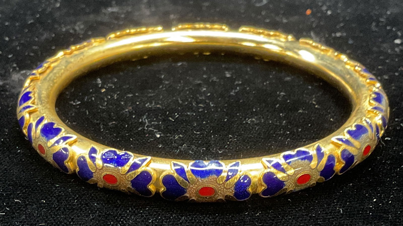 Gold Tone Enamel Flower Bangle Bracelet: Gold tone bangle with raised enamel flower design. Measures approx 2.5 inches wide. Some scratching observed. Jewelry, estate jewelry, costume jewelry, cocktail jewelry, fashion jewelry, accessories,