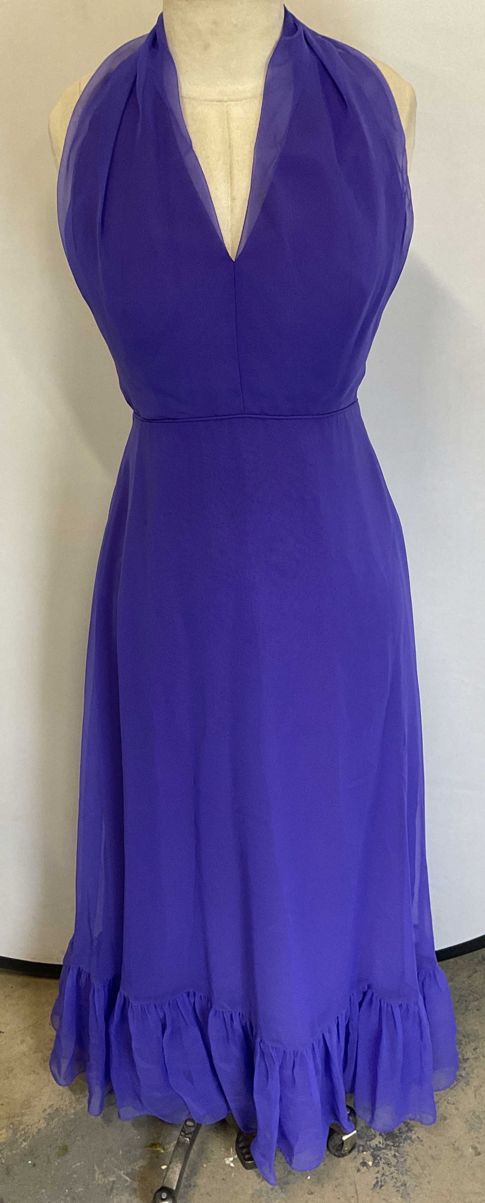 Vintage Purple Chiffon Halter Neck Gown: Vintage purple chiffon sleeveless halter neck gown. Measures approx 14 inches across chest, 55 inches shoulder to hem. Synthetic material. Some blemishes. Gown, purple gown, chiffon gown, formal dress