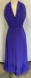 Vintage Purple Chiffon Halter Neck Gown: Vintage purple chiffon sleeveless halter neck gown. Measures approx 14 inches across chest, 55 inches shoulder to hem. Synthetic material. Some blemishes. Gown, purple gown, chiffon gown, formal dress