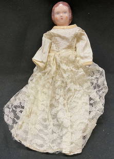 Vtg Ruth Gibbs Porcelain Doll W Cloth Body: Vintage Ruth Gibbs porcelain doll with cloth body. Porcelain head with painted hair and facial features. Porcelain arms and legs. Cream sheer and lace dress. Marked with RG in the backside. Measures a