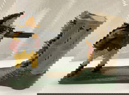 William Tell Shooting Mechanical Cast Iron Bank: William Tell Shooting Mechanical Cast Iron Bank Mechanical bank featuring a figurine in military attire holding a gun. Not tested for function. Signed & marked on underside. Surface wear consistent to