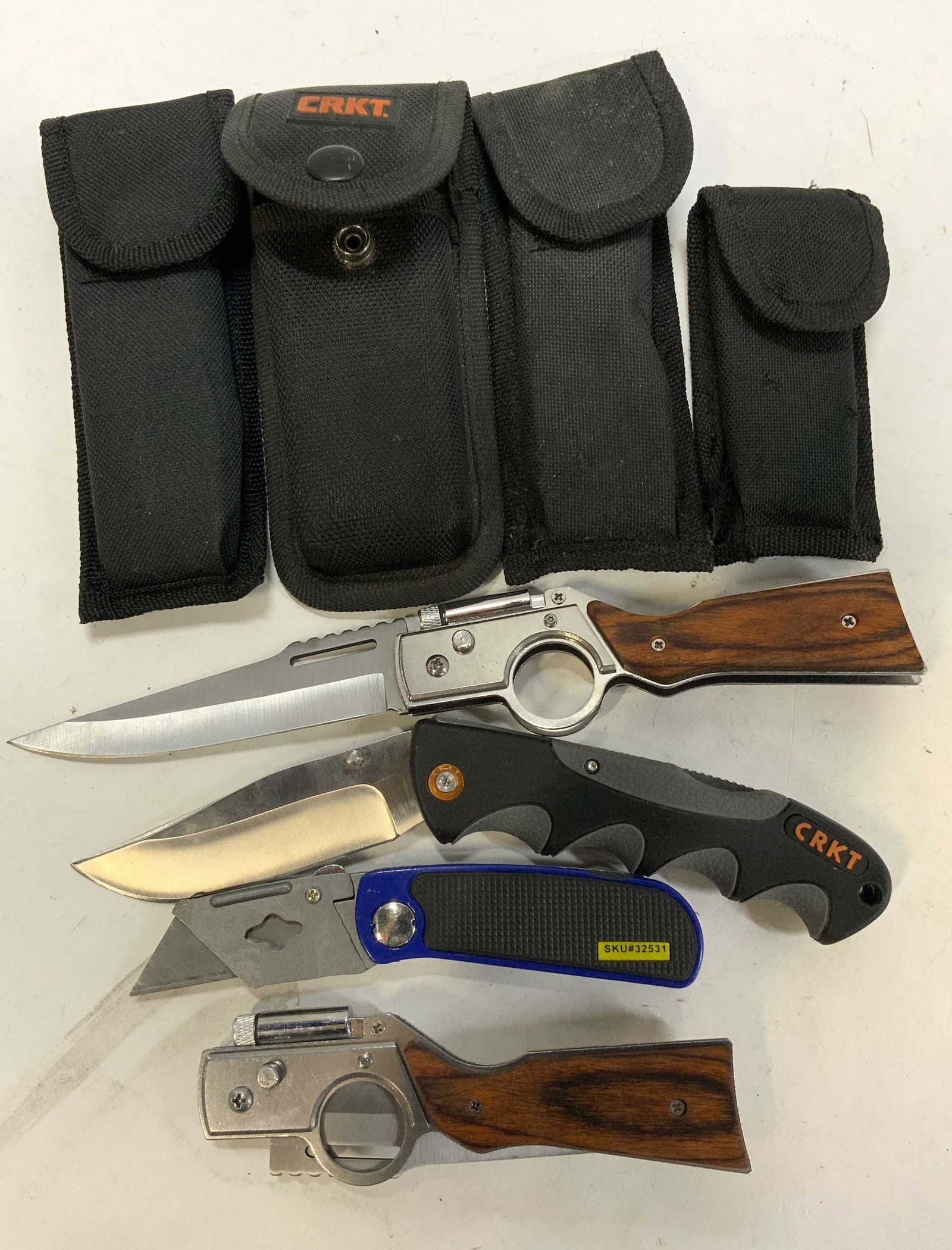 4+ Assorted Stainless Steel Knifes W Pouches CRKT+: 4+ Assorted Stainless Steel Knifes W Pouches CRKT+ Lot includes 4 pocket knifes & 4 black fabric holsters/pouches. Knifes appear to be stainless steel & are from different brands. Brand such as CRKT &