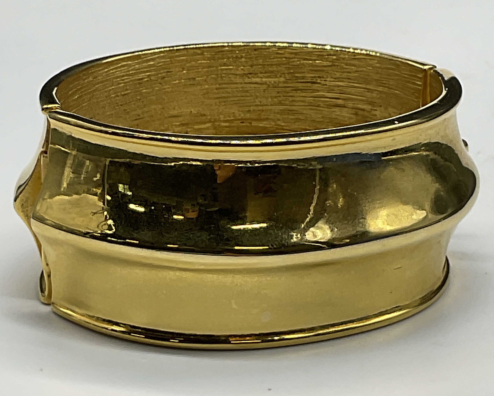 Vintage Chunky Polished Gold Tone Metal Bracelet: Vintage Chunky Gold Tone Metal Bracelet. Box clasp closure. Diameter measured at the widest point measures approx. 2.5 inches. Surface wear consistent with age, use, and exposure. Vintage jewelry, Vin