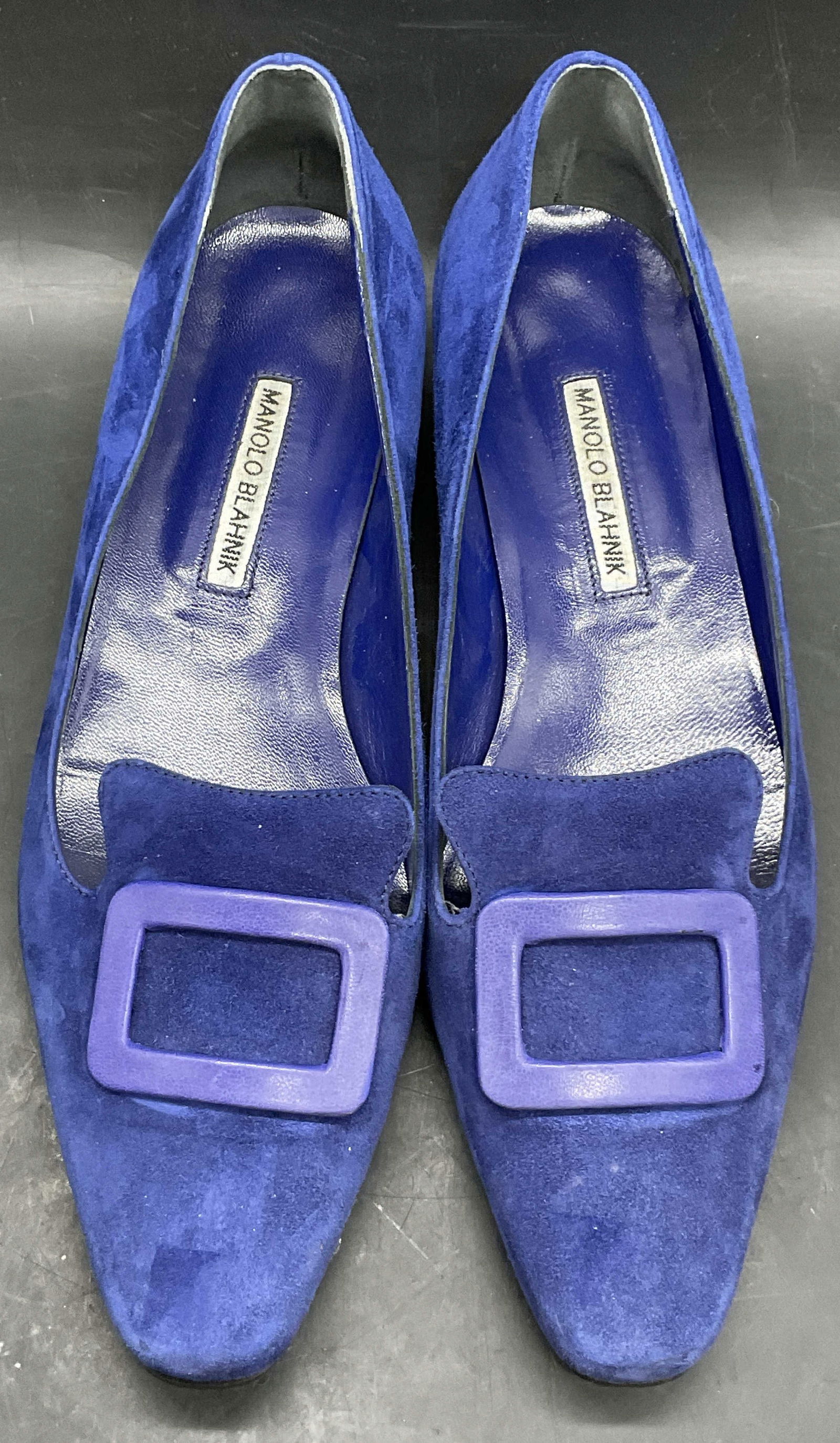 MANOLO BLAHNIK Blue Suede Buckle Accent Shoes: MANOLO BLAHNIK Vintage Blue Suede Buckle Accent Shoes. Underside reads 40, Handmade in Italy, MANOLO BLAHNIK. Length measures approx. 11 inches. Shoes are crafted from leather and other materials. Dis