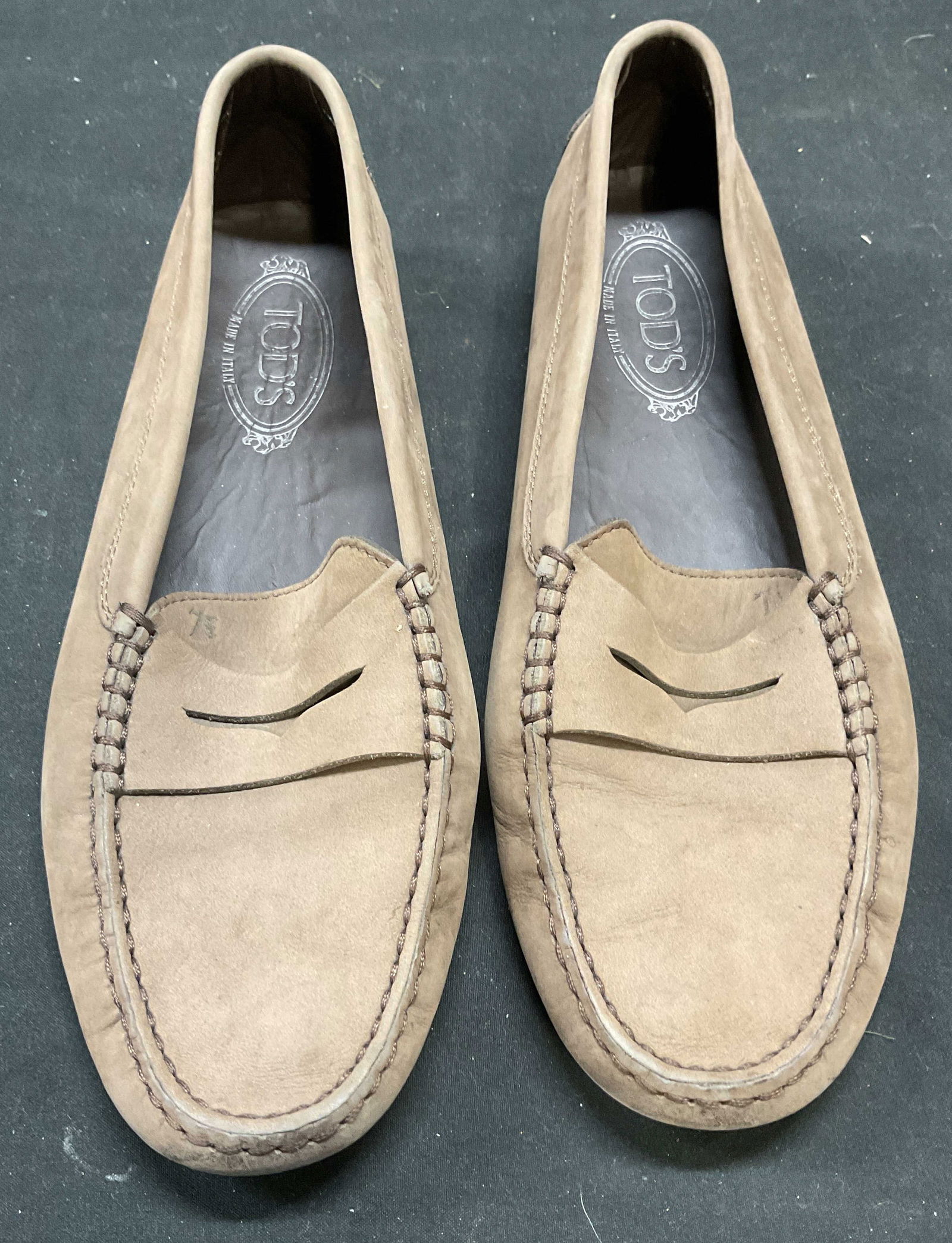 Tods Brown Leather Loafer, Italy: Tods brown leather loafer. Made in Italy. Size 40. Some wear including blemishes and scuffing. Tods, Tods loafer, Tods shoes, designer loafers, designer shoes, leather loafer, brown loafers, 10 cs