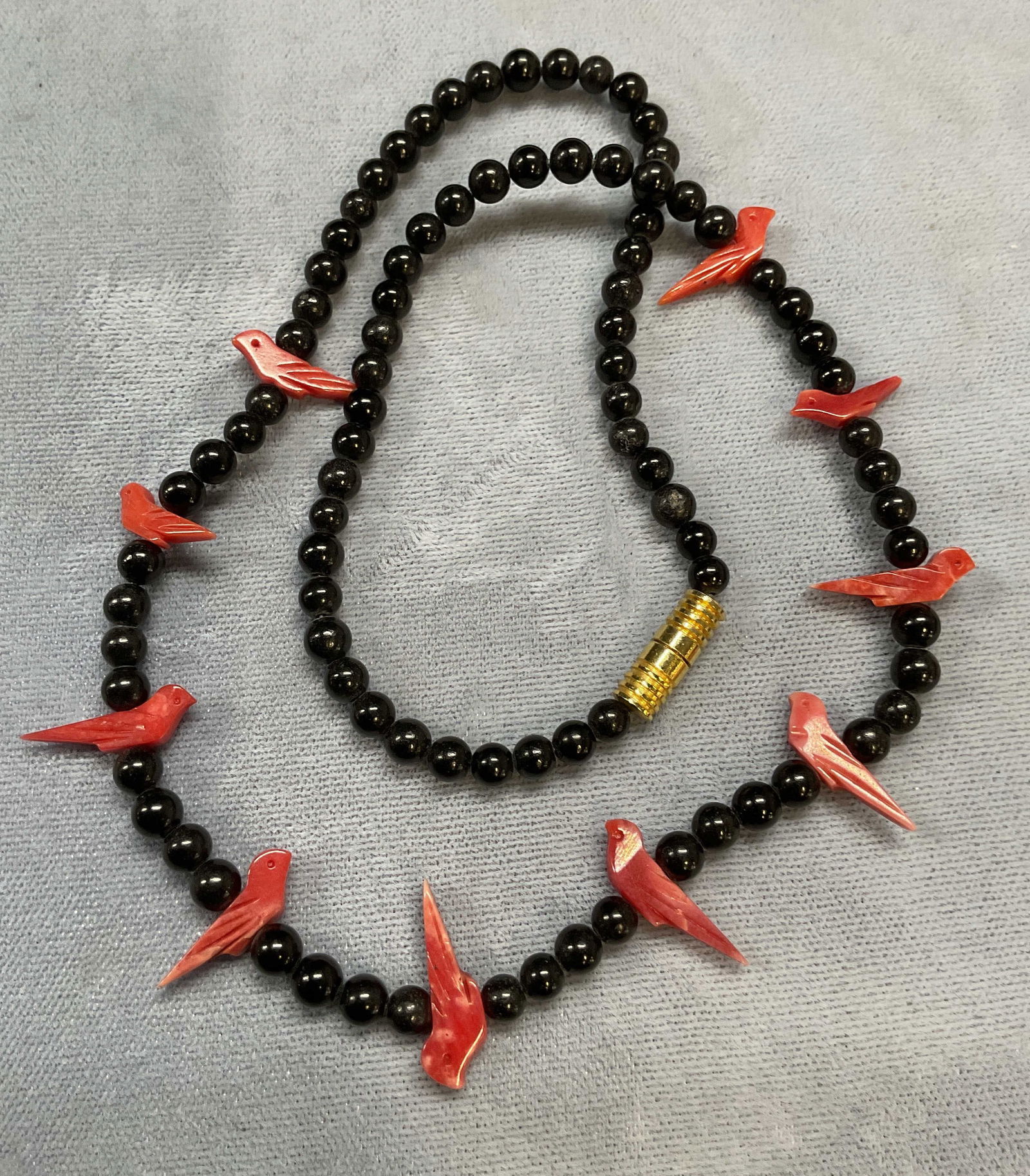 Vintage Carved Coral Bird & Black Stone Necklace: Vintage choker necklace with round black stone and carved coral bird motif pendants. Drop length approx 7 inches. Some wear including scratching. Jewelry, estate jewelry, fine jewelry, fashion jewelry