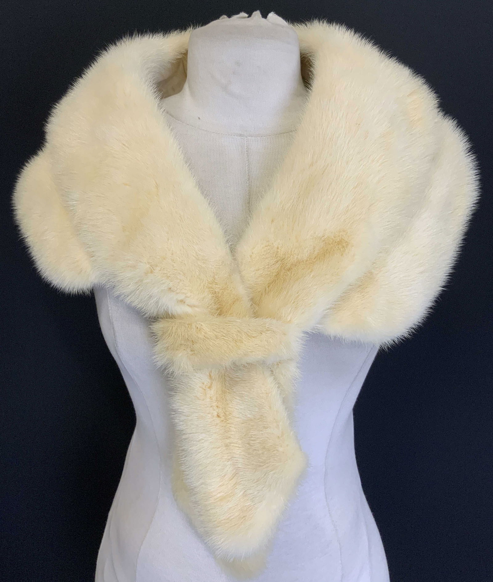 NICOLAI Furs Mink Stole Cream: Tag read NICOLAI FURS MILWAUKEE. Mink stole is cream toned. Backside lined with cream toned fabric possibly satin. Stole embroidered Dorothy Clifford. Measures approx 36 inches ling when fully spread
