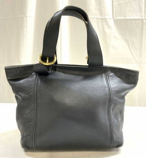 COACH Black Leather Tote K5H 4133: Interior is inscribed COACH NO K5H 4133. Tote is black toned and leather. OIECE has gold toned gilt metal hardware. Interior has zippered pocket. Straps are adjustable. Measures approximately 12 inche