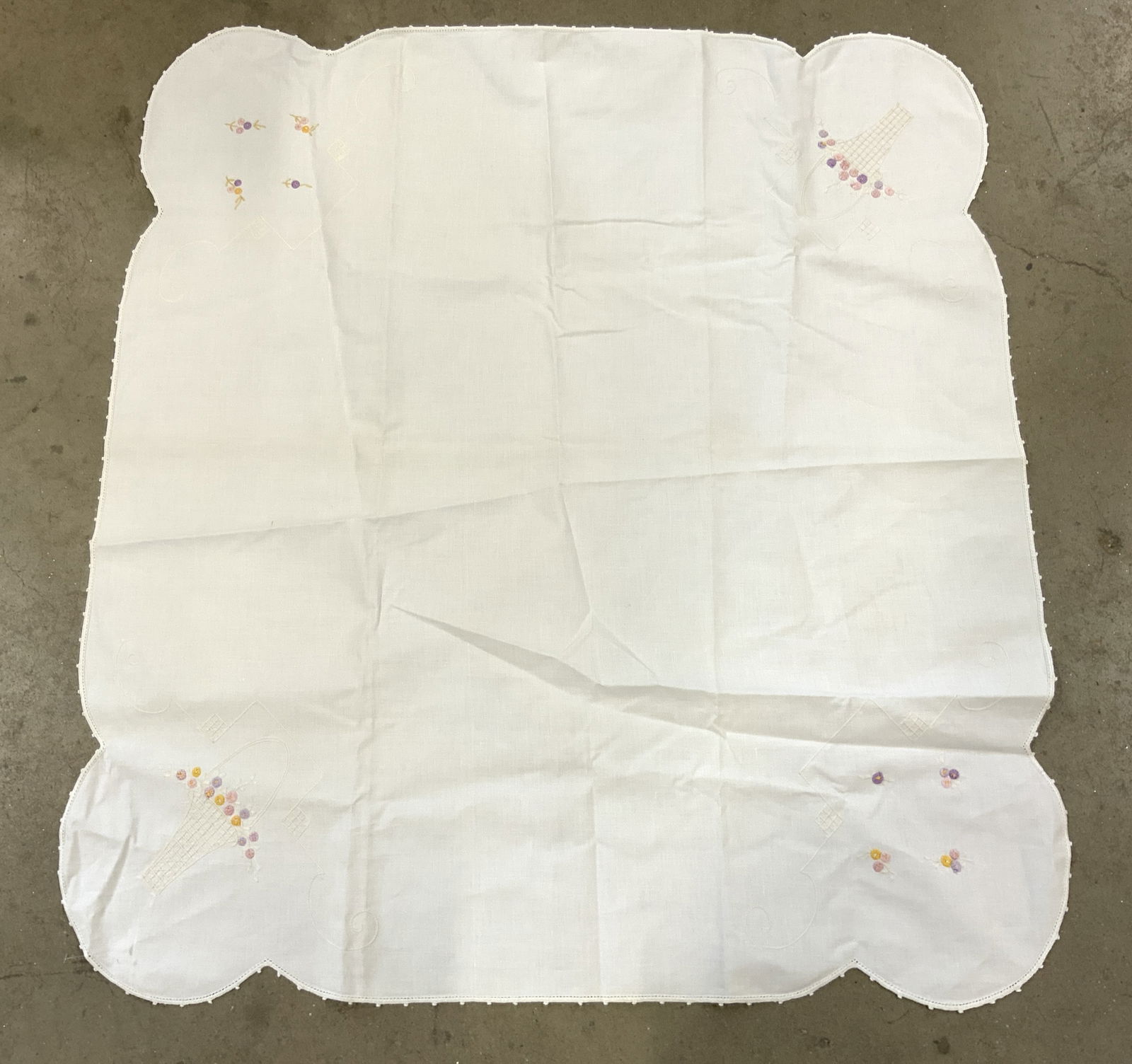 Vintage Bridge Tablecloth W Floral Detail: Tablecloth is white toned and vintage. Piece has embroidered multi toned floral detail. Tablecloth measure approximately 36 inches square. Tablecloth, vintage tablecloth, bridge tablecloth, floral tab