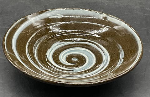 Trademarked Vintage Artisan Pottery Swirl Dish: Trademarked Vintage Artisan Pottery Swirl Dish. Measures approx. 1.5H x 5.75W in. Brown and blue hues to the piece. Trademarked on the underside. Pitting and surface wear present. home decor, home acc