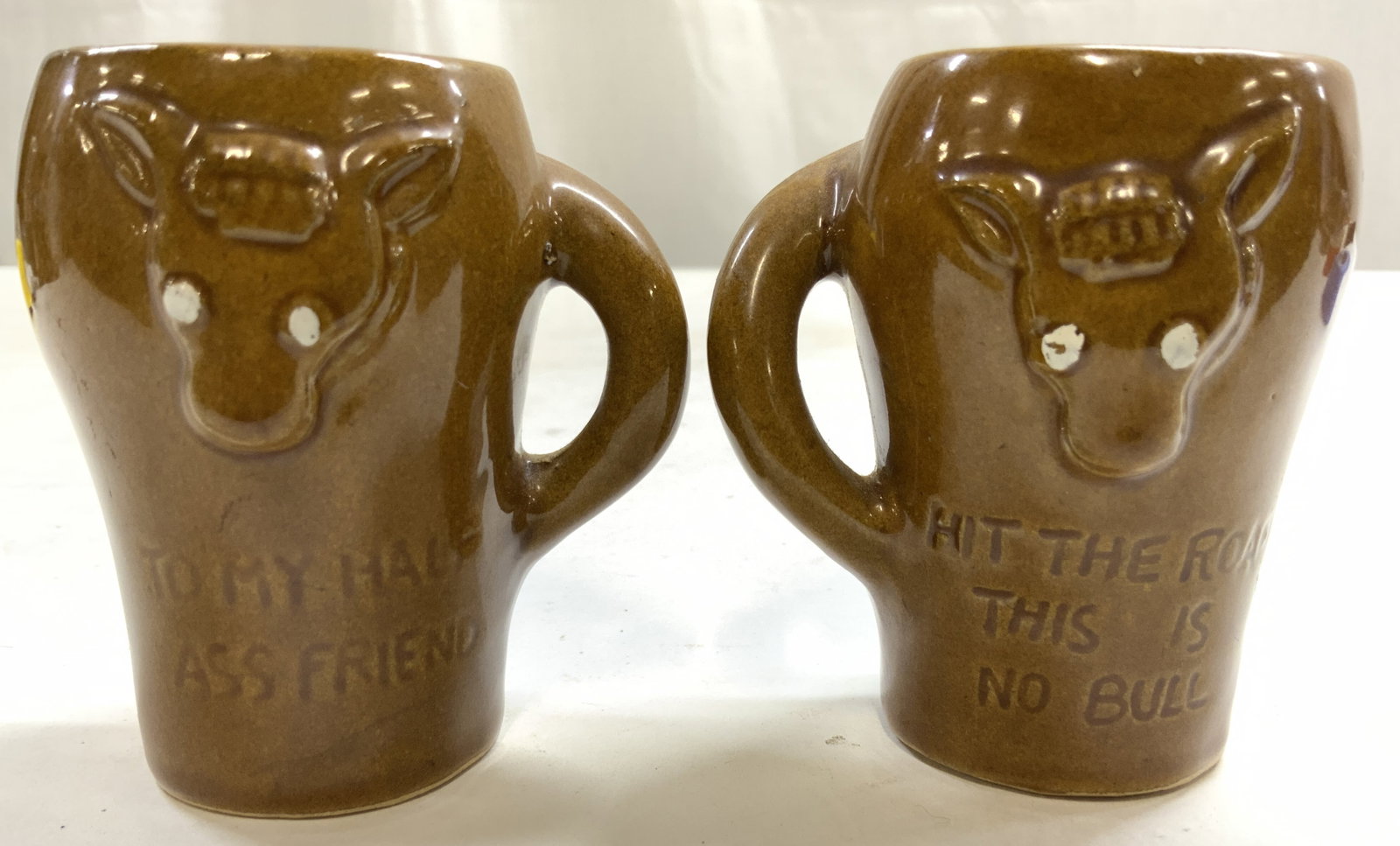 Vntg Jackass Hand Painted Porcelain S&P Shakers: Tags read JAPAN. Lot includes 1 salt and 1 pepper shaker. Each piece is light brown toned and wooden. Each shaker has Form of donkey. Tops are painted reading Indiana Hoosier State. Shakers also read 