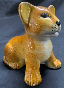 Vtg 1970s Italian Glazed Ceramic Lion Cub Sculpt: Lion cub sculpture is vintage circa 1970s. Piece is ceramic, possibly hand crafted, hand painted. Piece is orange toned with facial features. Depicts a seated lion cub figure. Piece measures approxima