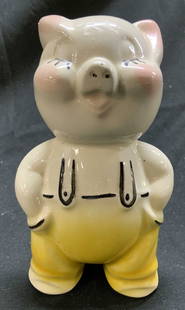 Vntg Porcelain Shawnee Pottery piggy bank: Appears to be SHAWNEE POTTERY (no apparent markings) Piggy bank is vintage. Piece is hand painted and porcelain. Depicts a standing pig figure wearing overalls. Piece has coin slot in backside of head