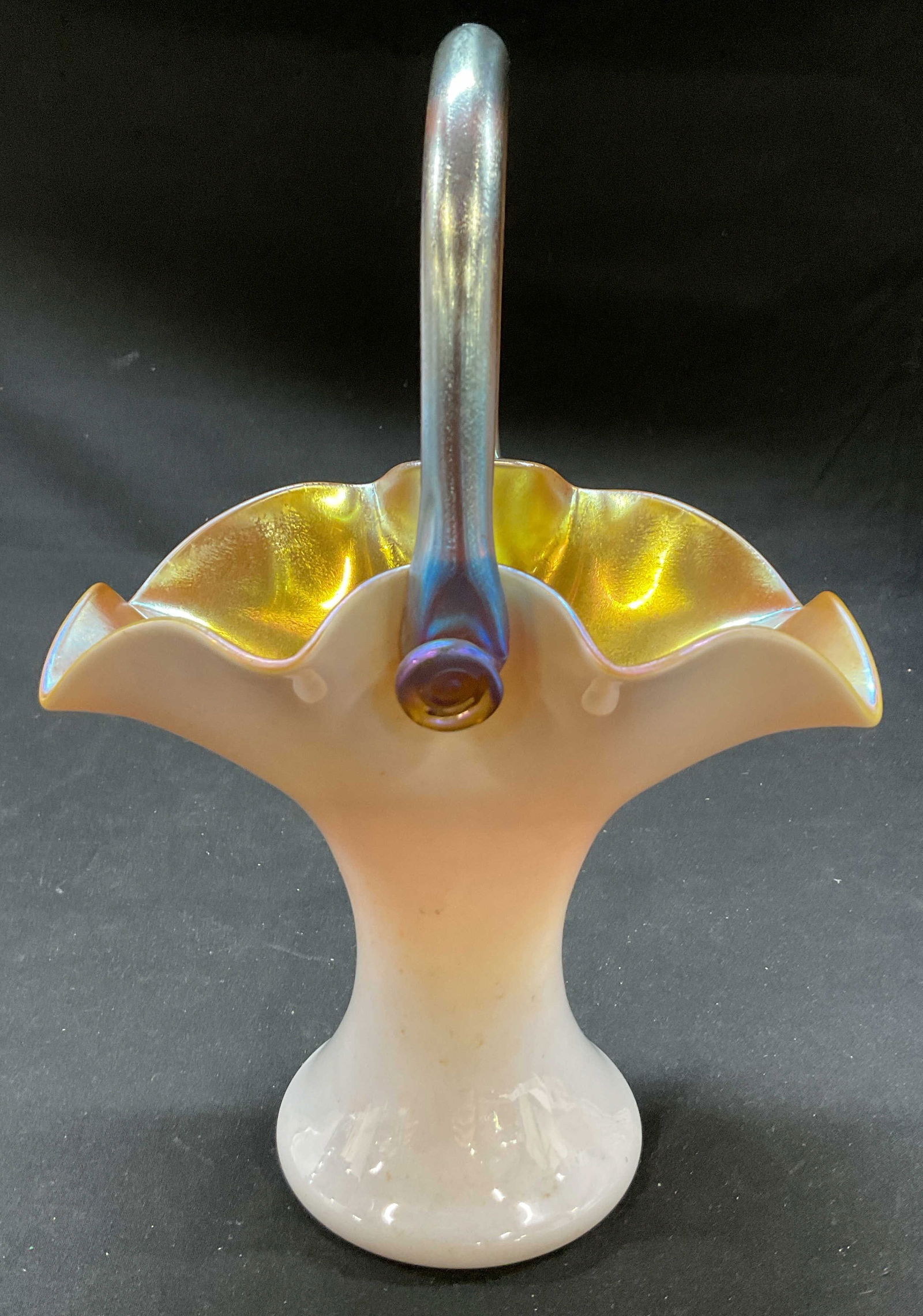 Vtg Iridescent Art Glass Basket: Glass basket. Raspberry prunts, gold aurene interior. Piece is unsigned. Possibly Carder Steuben, Quoizel, or Loetz. Basket with handle. 6 x 9.5 x 5 inches. Some surface wear consistent with exposure.