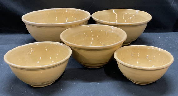 Set 5 Antique Yellowware Pottery Mixing Bowls: Set of 5 antique Yellowware pottery mixing bowls. Hand painted solid yellow and with raised double line pattern. Nesting bowls, sizes vary. Largest bowl measures approx 10 x 4.75 inches. All bowls hav