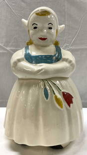 Vintage Dutch Girl Ceramic Cookie Jar: Vintage Dutch Girl Ceramic Cookie Jar Cookie jar depicting a Dutch girl figure. She is wearing a white cap, apron & has colorful tulips on her dress. No visible signature or markings. Surface wear con