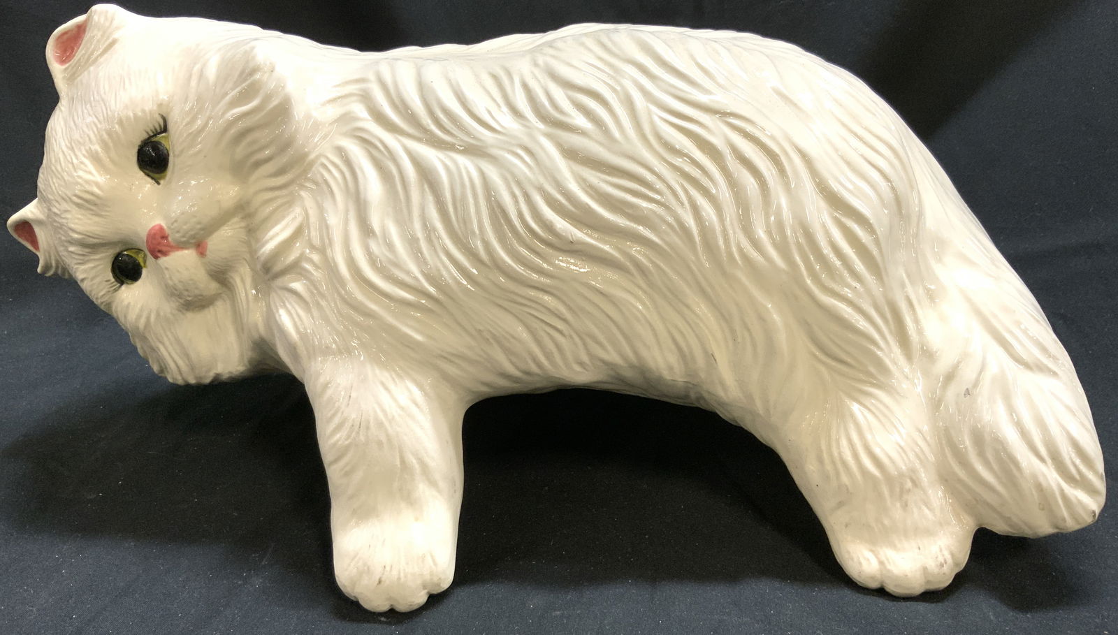 Hebertas Molos Ceramic Cat Figure: Underside is inscribed HEBERTAS MOLOS INC. Cat figure is cream toned and ceramic. Piece has relief areas to show fur detail. Cat figure is hand painted with facial detail. Piece measures approximately