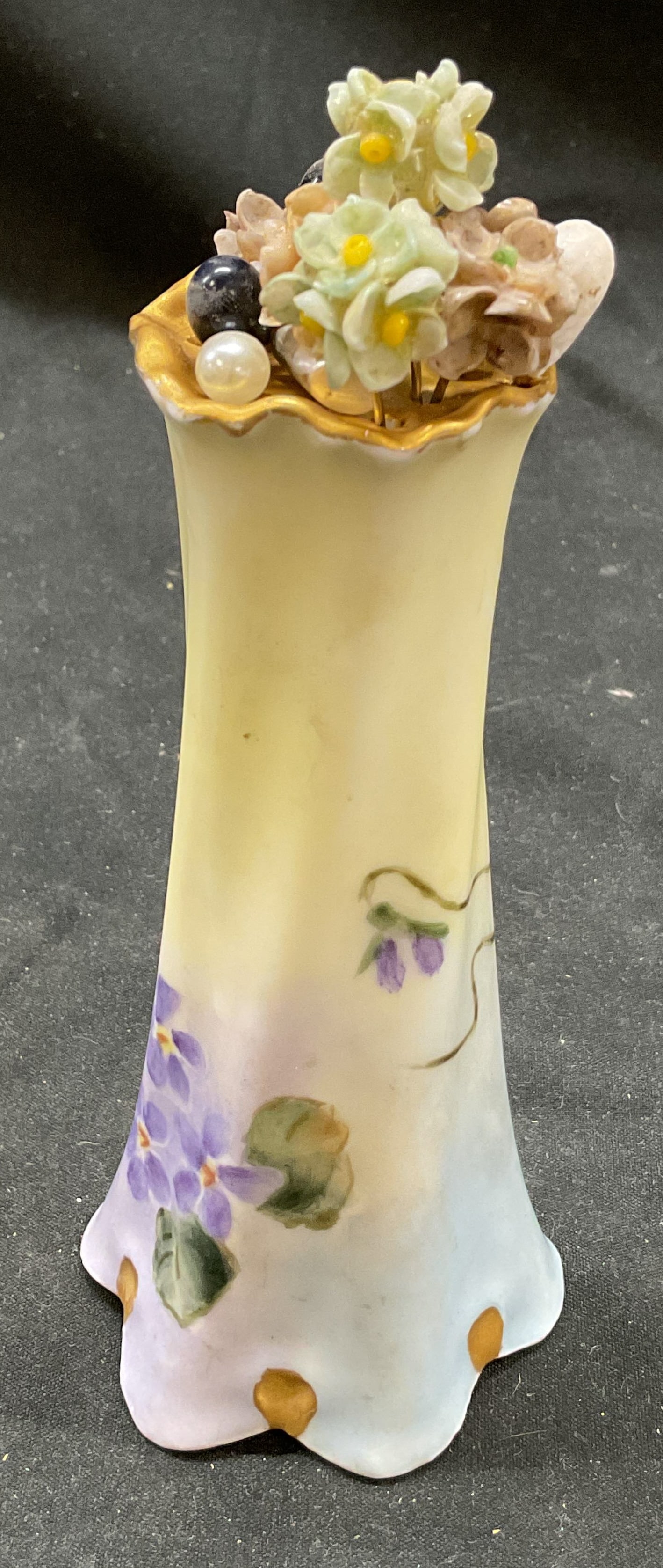 Vtg Bavaria China Hand Painted Hatpin Holder: Vintage Bavaria China hand painted hat pin holder. Violet patterned design. Signed on underside. 13 pins included. 5 x 2.5 inches. Some surface wear consistent with exposure. Bavaria, China, fine chin