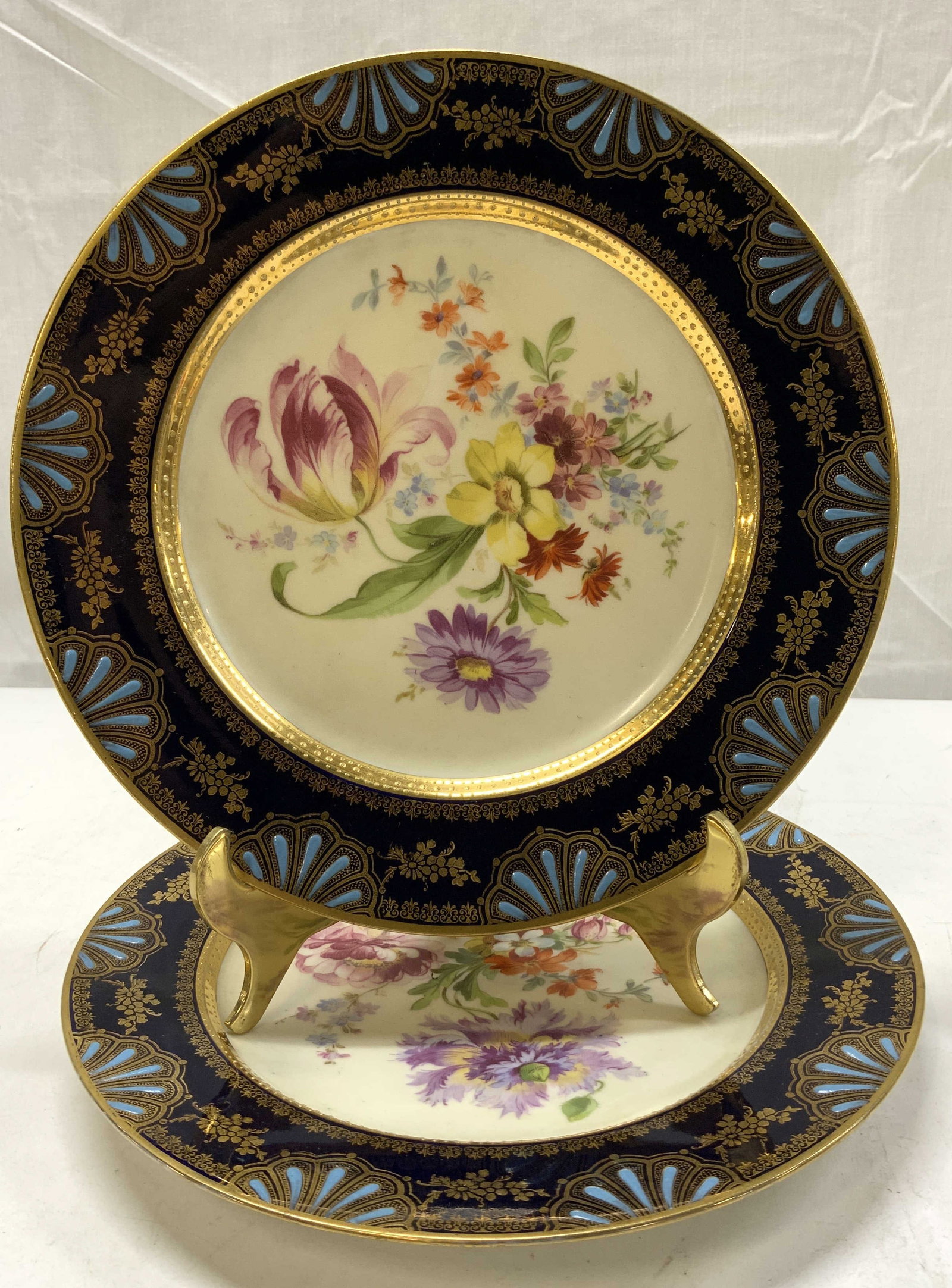 2 ROYAL VIENNA Ornate Porc Floral Plate GERMANY: 2 ROYAL VIENNA Ornate Porc Floral Plate GERMANY Pieces have ornate gold detailing around the rim & inner oval border. The center of the piece features a hand-painted floral design, showcasing a vibran