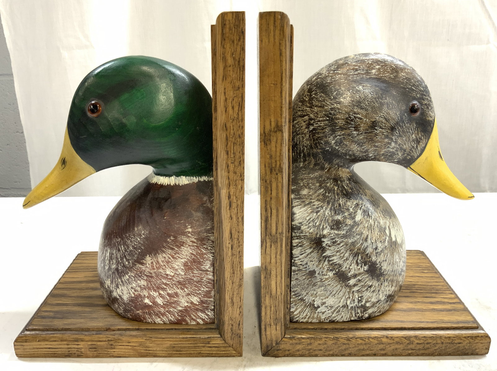 Set 2 Mallard & Mallard Hen H Pntd Wood Bookends: Lot includes 1 mallard bookend & 1 mallard hen bookend. Each are wooden, appear to be hand painted. Bookends are possibly vintage. Each piece measures approximately 8.25 inches tall 5.75 inches deep 5