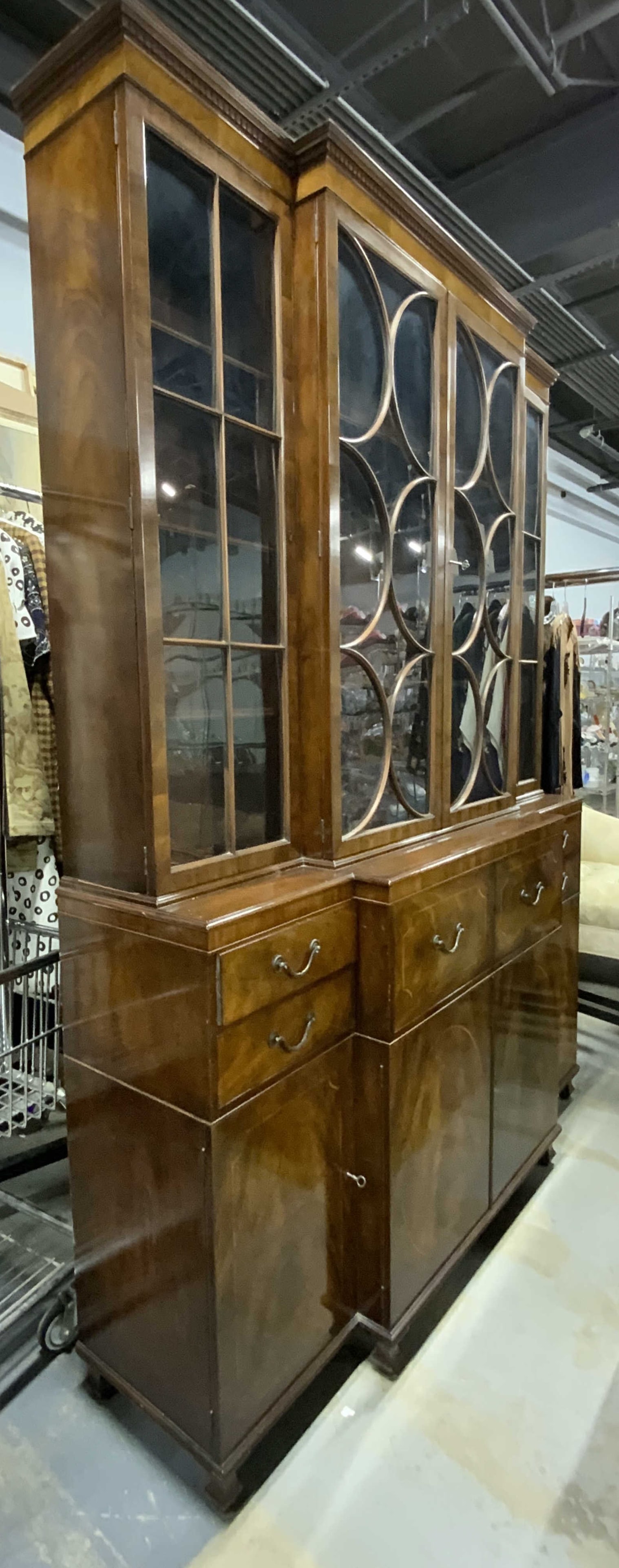 Vintage Wooden China Cabinet W Desk: China cabinet is vintage and wooden. Piece is brown toned. Top have has windowed doors. Side upper cabinets have 3 shelves each, center has 2. Lower have has leather lined desk. Interior has small dra