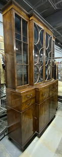 Vintage Wooden China Cabinet W Desk: China cabinet is vintage and wooden. Piece is brown toned. Top have has windowed doors. Side upper cabinets have 3 shelves each, center has 2. Lower have has leather lined desk. Interior has small dra