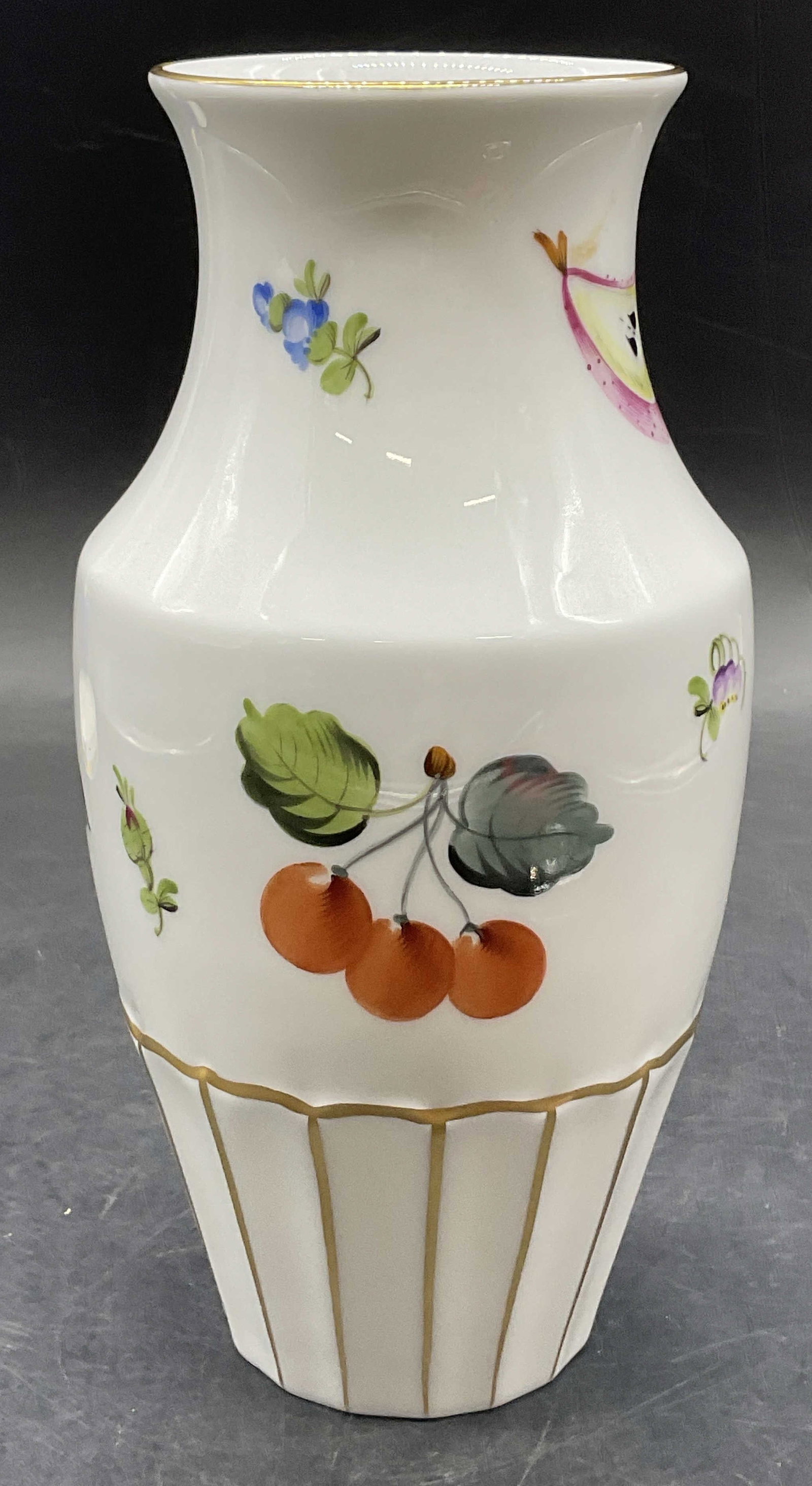 HEREND HUNGARY Hand Painted Porcelain Fruit Vase: HEREND HUNGARY Hand Painted Porcelain Fruit Motif Vase . Underside signed HEREND HUNGARY, HAND PAINTED. Other verbiage illegible. Fruits and florals to the design. Measures approx. 7.75H x 4W in. Meas