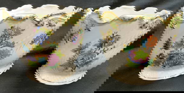 HEREND Pr Vntg Porc Footed Floral Cache Pots: Undersides are marked HEREND HUNGARY. Lot includes 2 cache pots . Each are white toned and porcelain with gilt rims and multi toned floral motif detail. Cache pots are footed. Each have light green to