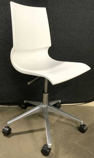 RICCIOLINA DWR Armless Swivel Desk Chr Wht: Underside is trademarked RICCIOLINA Design MARCO MARAN MAX DESIGN. Chair is white toned. Piece has chrome base with 5 wheels. Armless office chair, computer chair. Originally purchased from DESIGN WIT