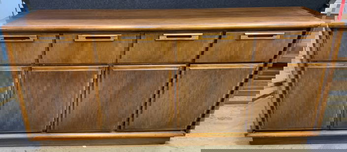 MCM Vtg Walnut Sideboard Buffet W Drawers: Sideboard is vintage and wooden, appears to be walnut. Buffet is tan toned. Piece has 4 drawers each with wooden handles and hand dovetailing. Lower half has 4 cabinet doors. Measures approximately 68