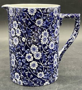 CRAWFORD CHINA CO. ENGLAND CALICO Ceramic Pitcher: CRAWFORD CHINA CO. ENGLAND CALICO Ceramic Pitcher. Blue and white floral motif to the piece. Measurements to interior. Underside stamped CRAWFORD CHINA CO. STAFFORDSHIRE ENGLAND, CALICO. Measures appr
