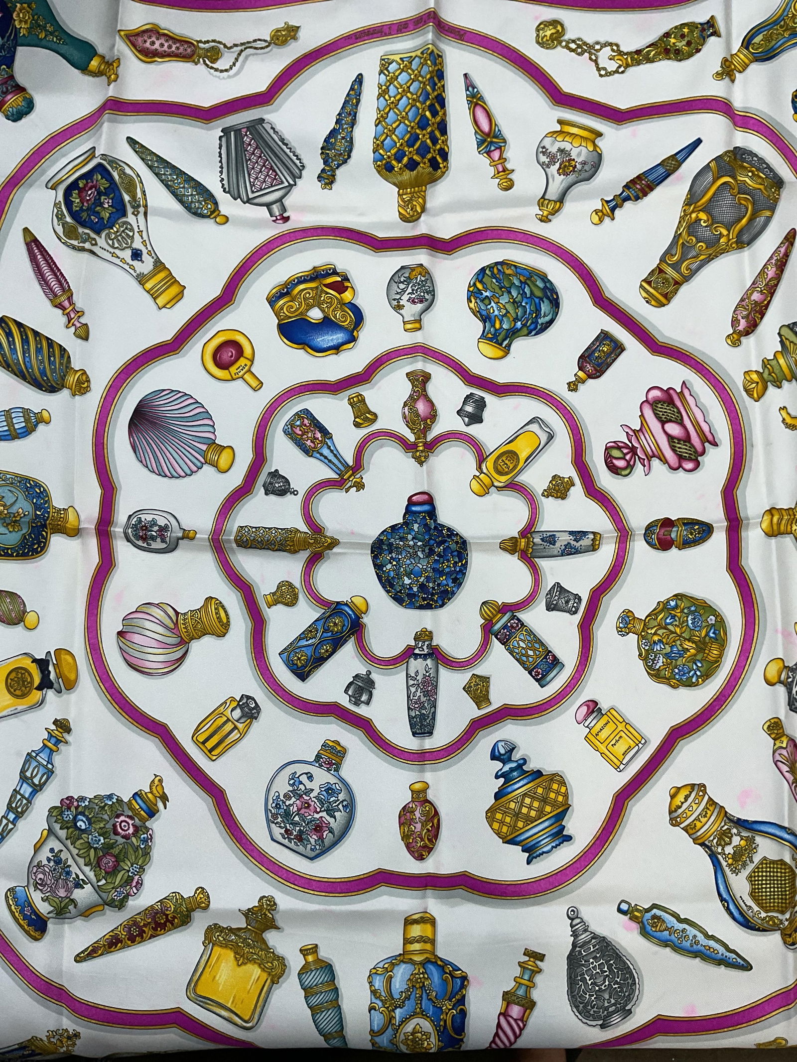 Hermes Pourvu Qu On Ait L Iveresse Silk Scarf: Hermes Pourvu Qu On Ait L Iveresse scarf. Perfume and snuff bottle print. Black border and multicolor printed center. Silk twill. Hand rolled edges. Made in France. Measures approx 34 x 34 inches. Som