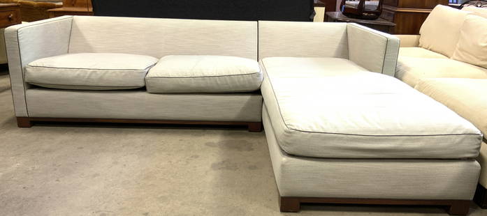 J&P Custom Den Sectional Sofa W Chaise: J&P custom den sectional sofa. One side of sectional has chaise lounge. Light slate custom Pierre Frey Boussac Fabric with dark grey toned welting at edges. Sectional has brown toned wooden feet. Cush