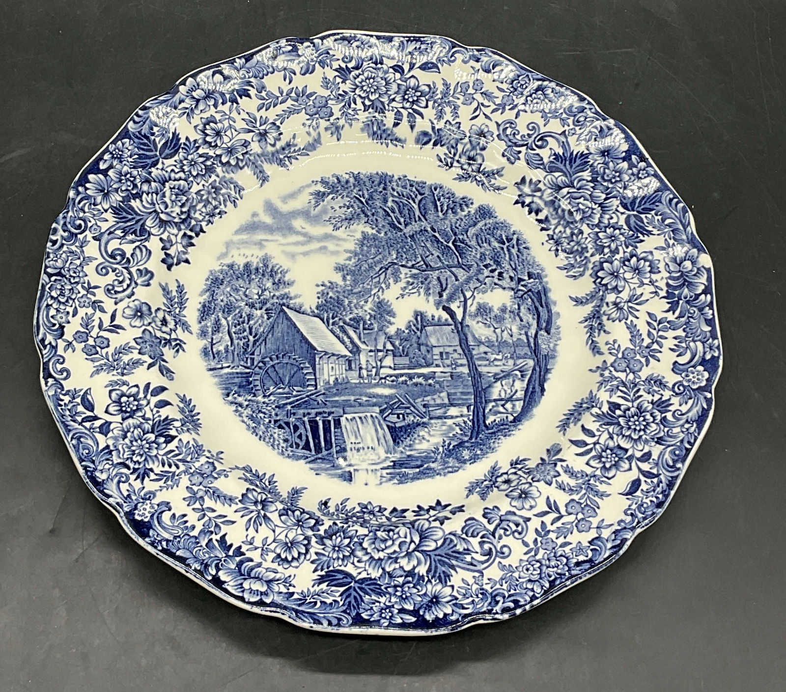 JOHNSON BROS ENGLAND MILL STREAM Ceramic Plate: JOHNSON BROS ENGLAND MILL STREAM Ceramic Plate. Underside reads JOHNSON BROS, MADE IN ENGLAND, MILL STREAM. Measures approx. 9.75L x 9.75W in. Chipping, pitting, and surface wear present. home decor,